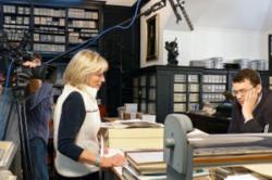 Image of Maggie Stogner filming expert for museum exhibit